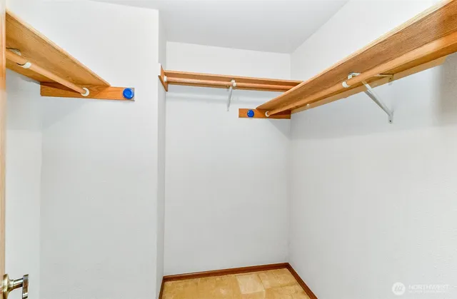 a view of a room with wooden floor and staircase