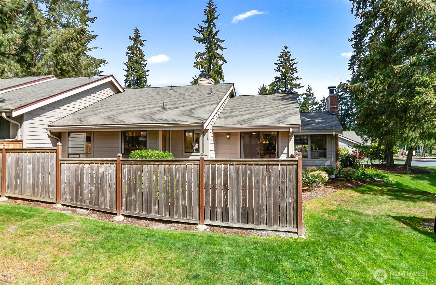 1324 Boise Street Fircrest, WA 98466 - Photo 7 of 39 a white house with a small yard and large trees