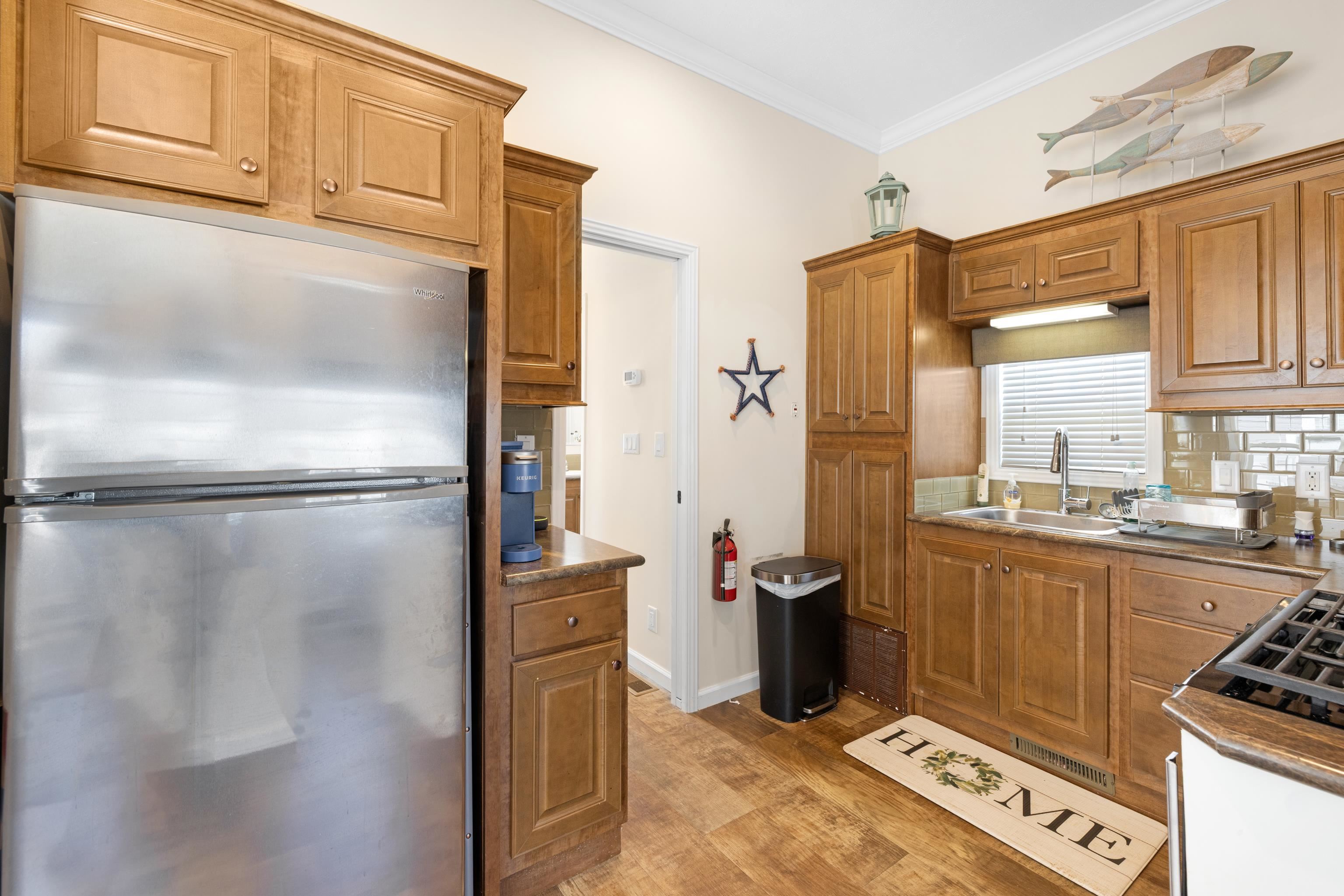 4100 Highway 9 Rio Grande, NJ 08242 - Photo 11 of 28 a kitchen with stainless steel appliances granite countertop a refrigerator and a stove top oven