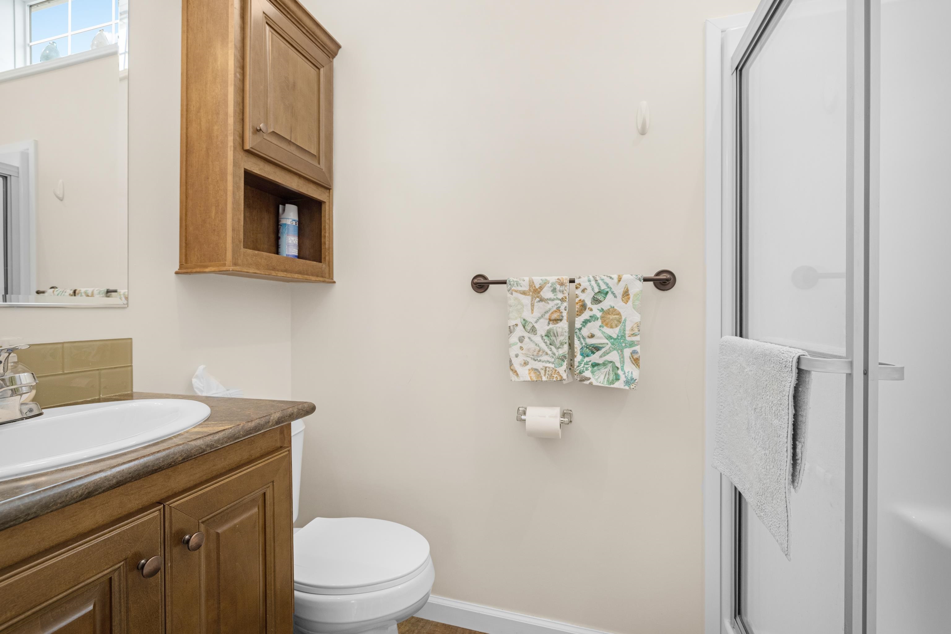 4100 Highway 9 Rio Grande, NJ 08242 - Photo 16 of 28 a bathroom with a sink a toilet and a mirror