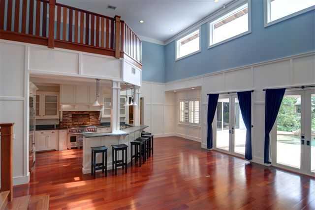 9 Palm Road Stuart, FL 34996 - Photo 8 of 25 a dining hall with stainless steel appliances granite countertop a stove top oven a dining table and chairs with wooden floor