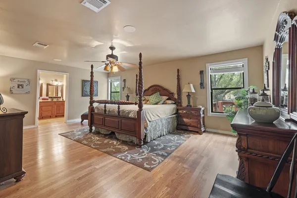 a bedroom with bed and a window