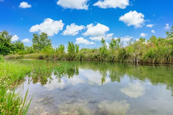 a view of a playground with basketball court