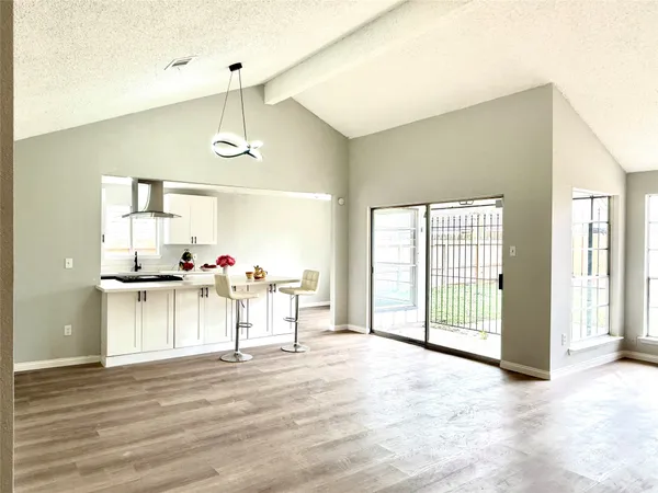 a view of a livingroom with furniture hardwood floor and a ceiling fan