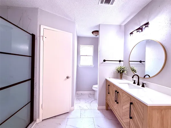 a bathroom with a double vanity sink and mirror