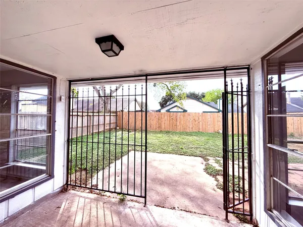 a view of a porch and garden