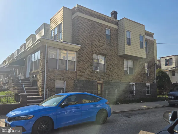 a front view of a house with parking space