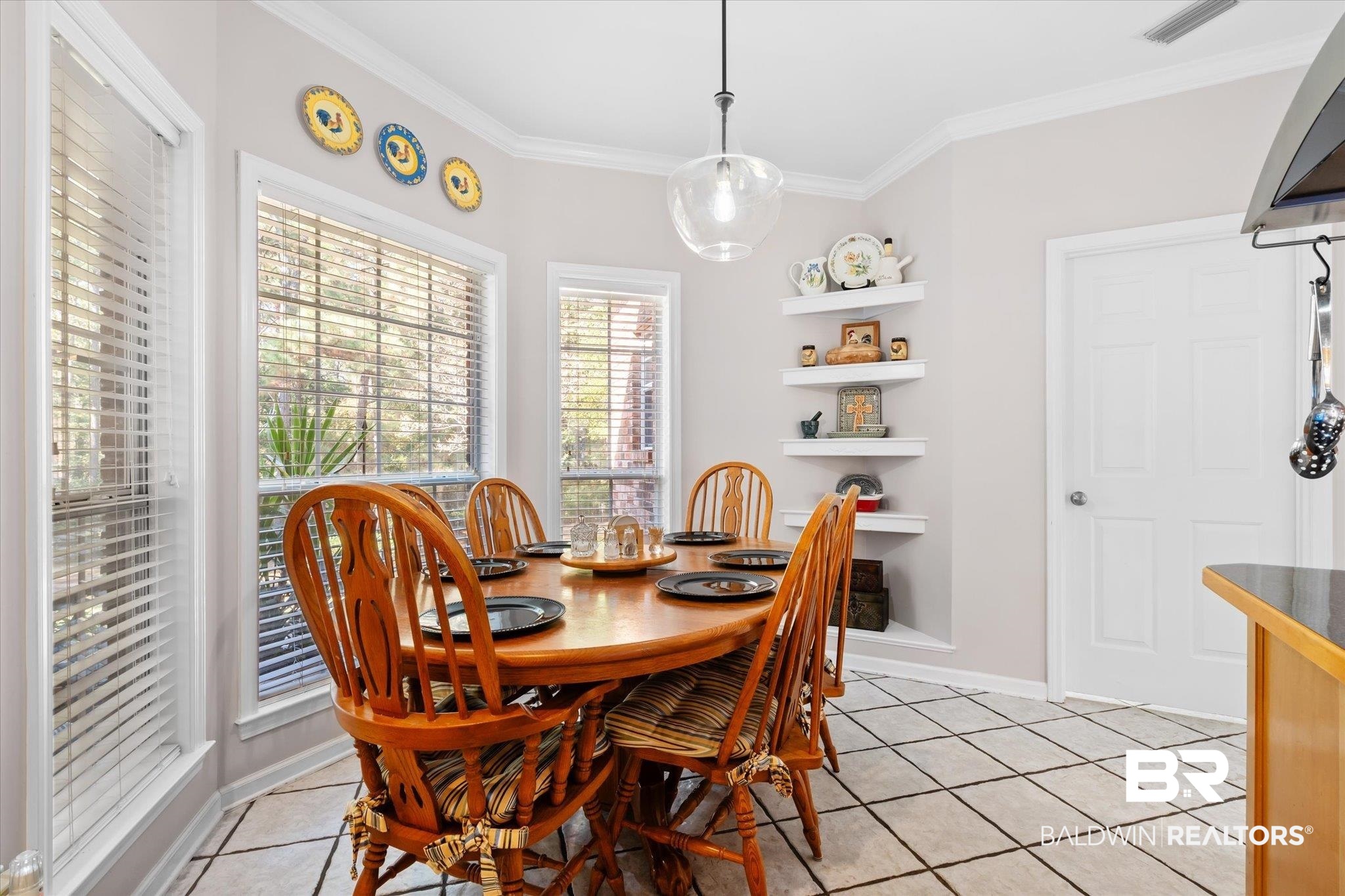 3651 Ching Dairy Loop Road South Mobile, AL 36618 - Photo 9 of 56 Tiled dining area featuring crown molding
