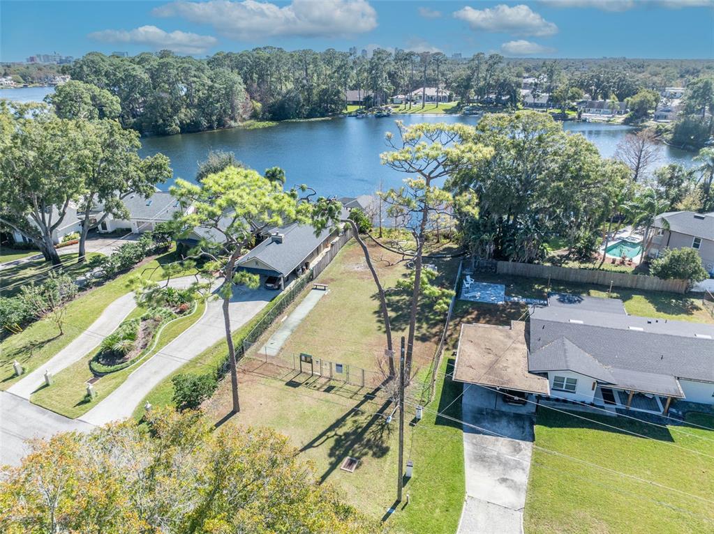 4234 Kendrick Road Orlando, FL 32804 - Photo 45 of 46 a view of a lake with a house in the background
