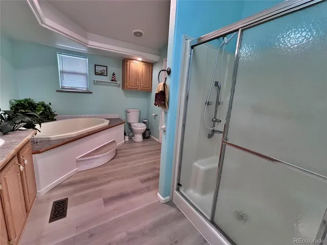 a spacious bathroom with a double vanity sink and a mirror
