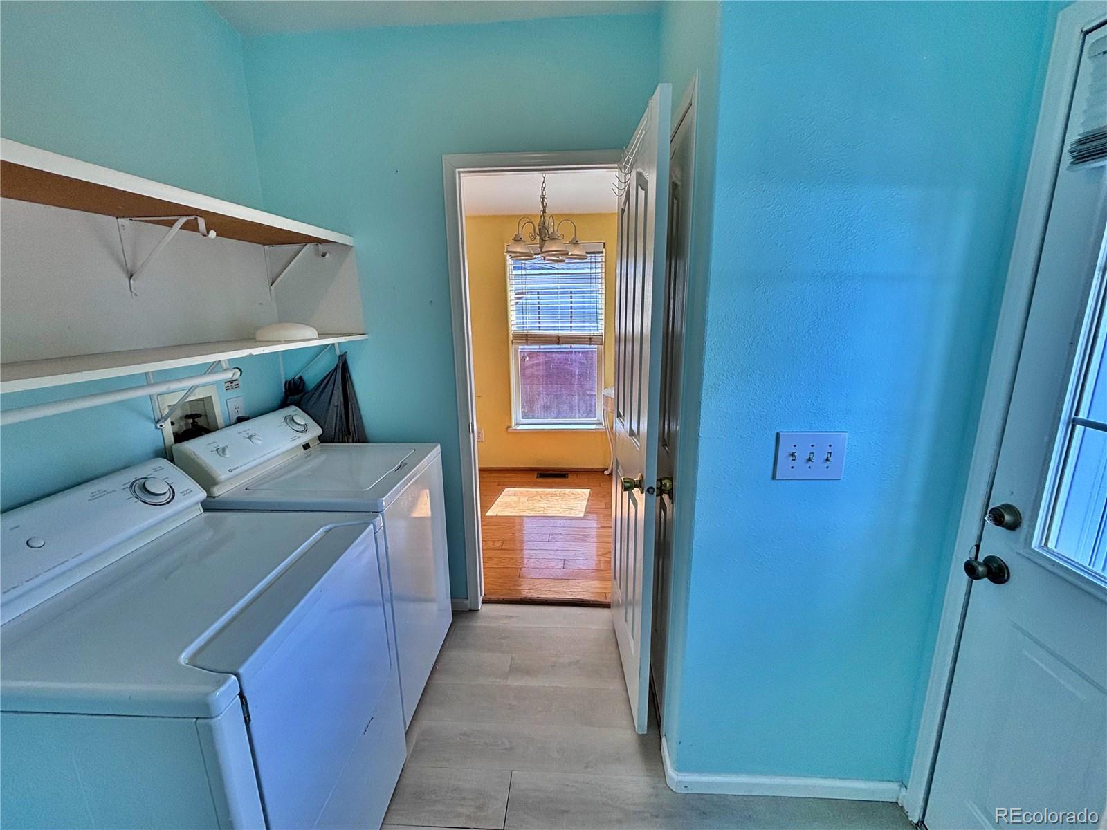 712 Meadowlark Drive Lafayette, CO 80026 - Photo 24 of 40 a utility room with dryer and washer