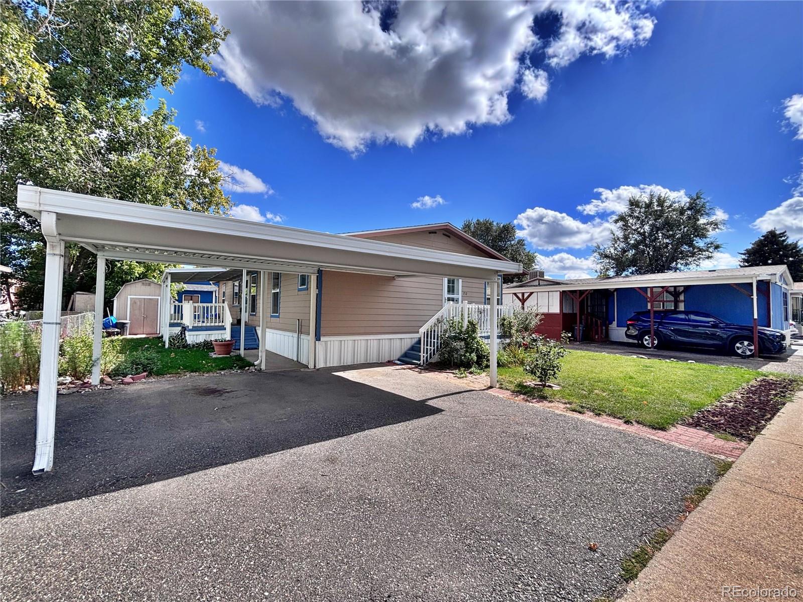 712 Meadowlark Drive Lafayette, CO 80026 - Photo 3 of 40 a view of a house with a yard