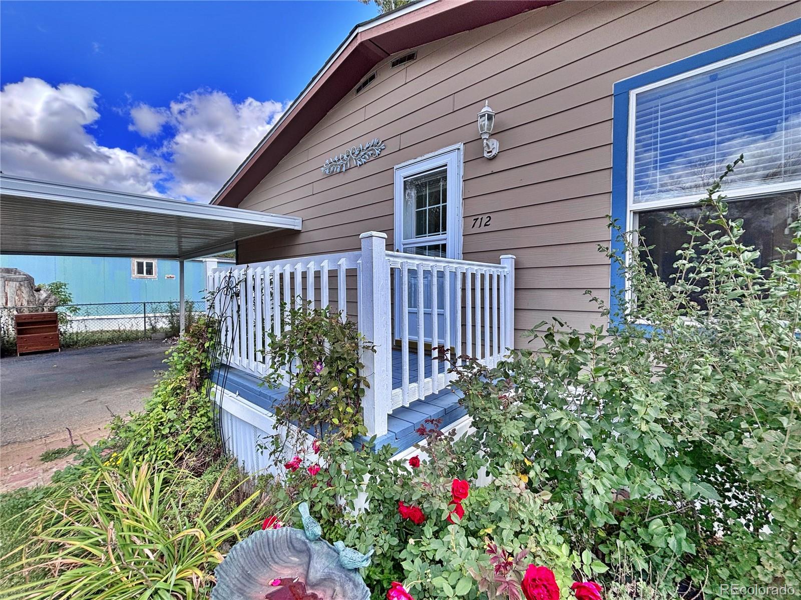 712 Meadowlark Drive Lafayette, CO 80026 - Photo 6 of 40 a view of a backyard with garden