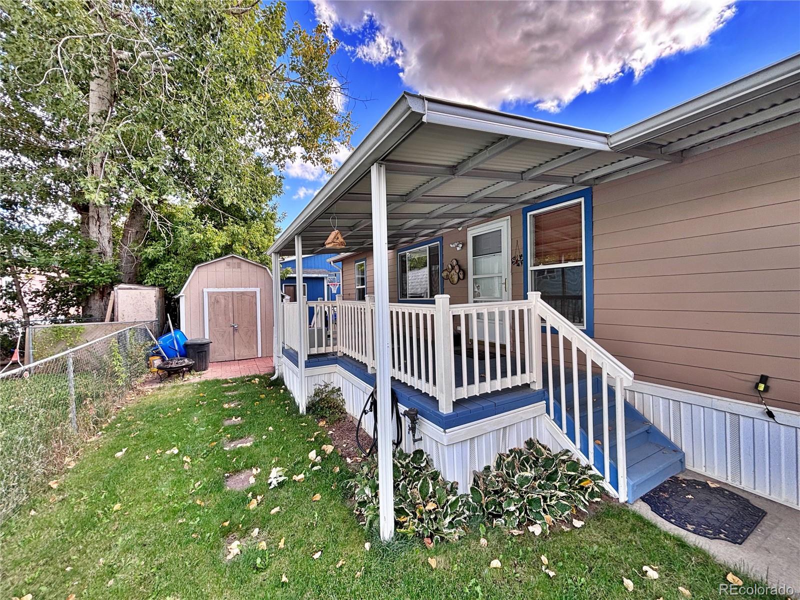 712 Meadowlark Drive Lafayette, CO 80026 - Photo 7 of 40 a view of a house with a yard and deck