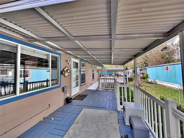 a view of a porch with wooden floor