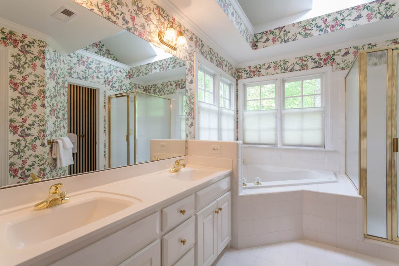 2408 Wertherson Lane Raleigh, NC 27613 - Photo 14 of 25 With dual vanity, whirlpool tub and separate shower. Also has large walk-in closet. Master Bath