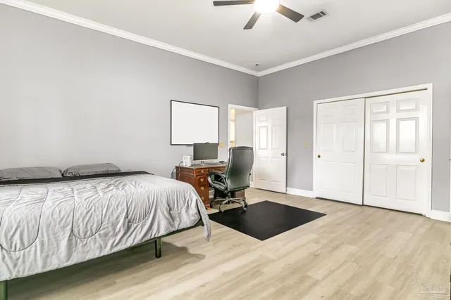 a bedroom with a bed and window