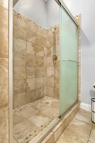 a bathroom with a shower and a toilet