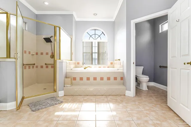 a view of a bathroom with a shower and a toilet