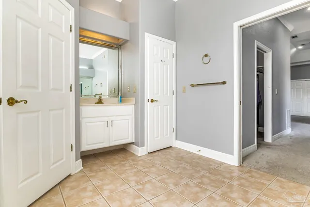 a view of a bathroom with a sink and a mirror