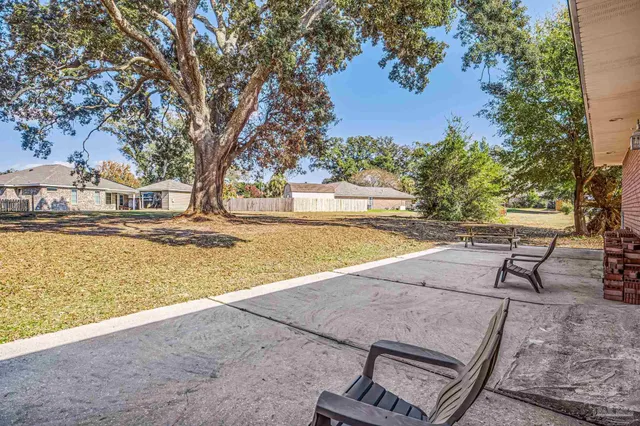 a view of a yard with an outdoor space