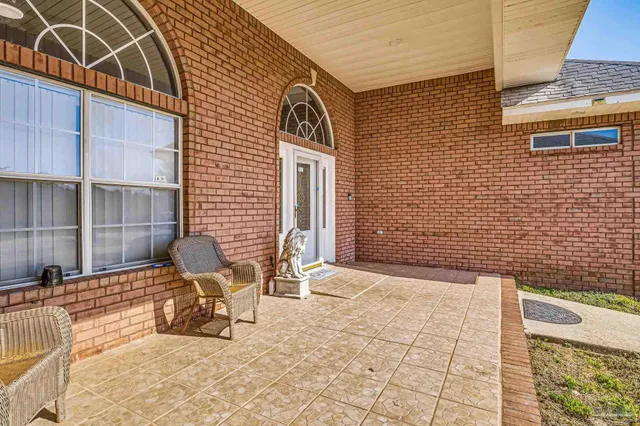 a view of two chairs in the balcony