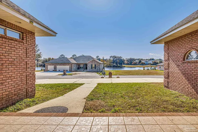 a view of a swimming pool and a yard