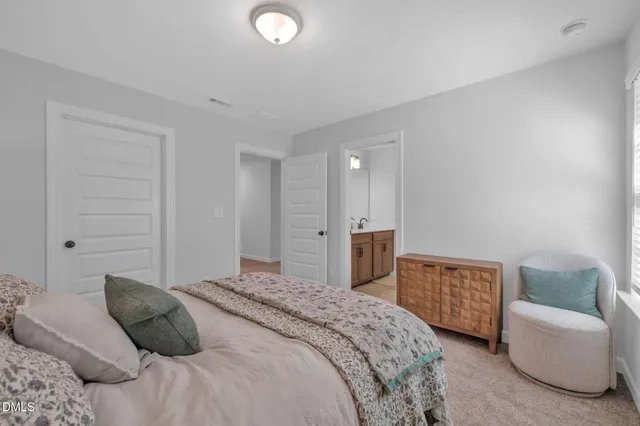 a spacious bathroom with a double vanity sink mirror and double