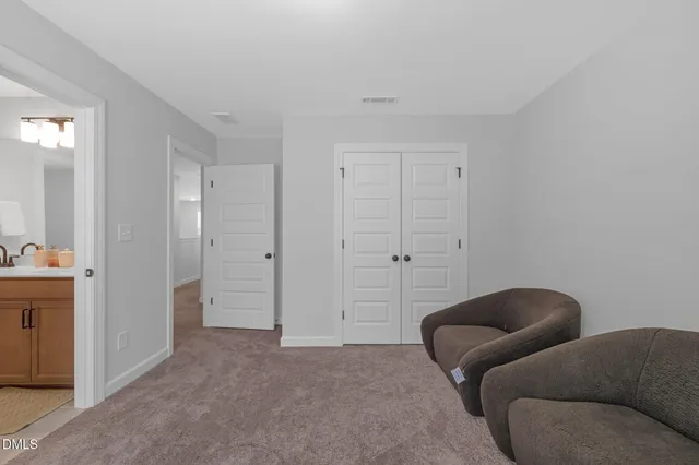 a view of house with front door and swimming pool