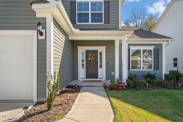 a front view of a house with garden