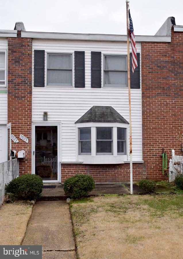 7925 Wynbrook Road Baltimore, MD 21224 - Photo 1 of 15 a front view of a house with a yard