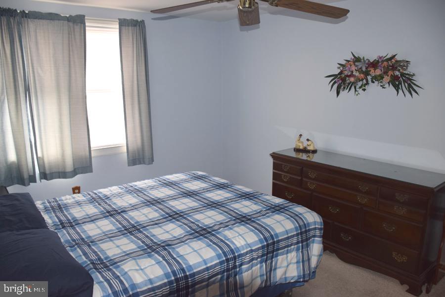 7925 Wynbrook Road Baltimore, MD 21224 - Photo 11 of 15 a bedroom with a bed and a window