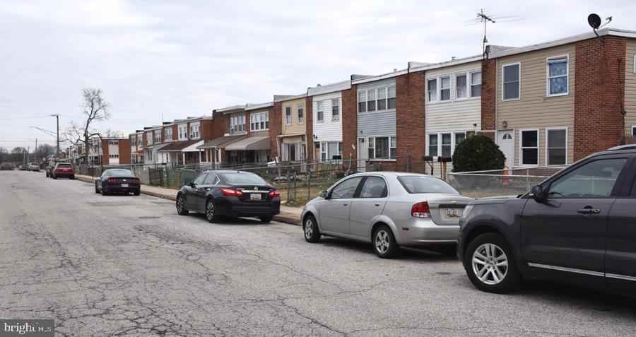 7925 Wynbrook Road Baltimore, MD 21224 - Photo 3 of 15 a view of cars parked in front of a house