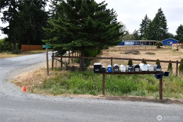a view of a yard with table and chairs