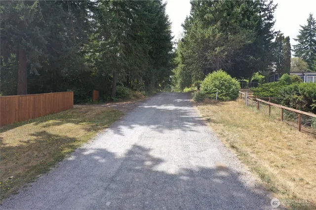 a backyard of a house with lots of green space