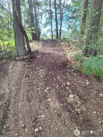 a bathroom with a bathtub and mirror