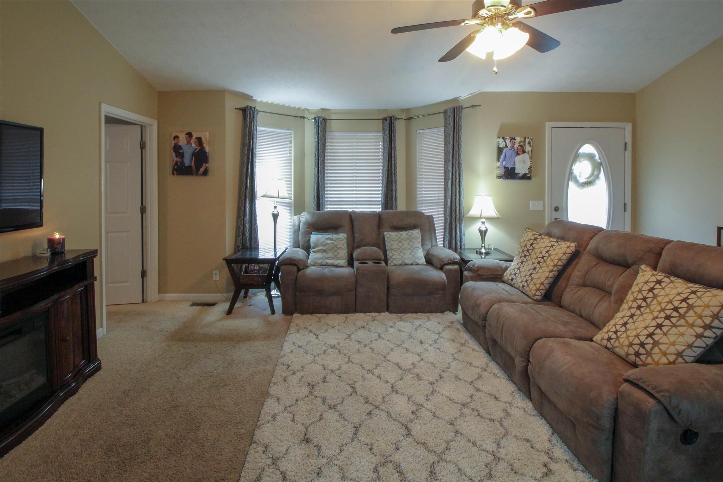 807 Hunters Crossing Lane Springfield, TN 37172 - Photo 8 of 16 a living room with furniture and a chandelier