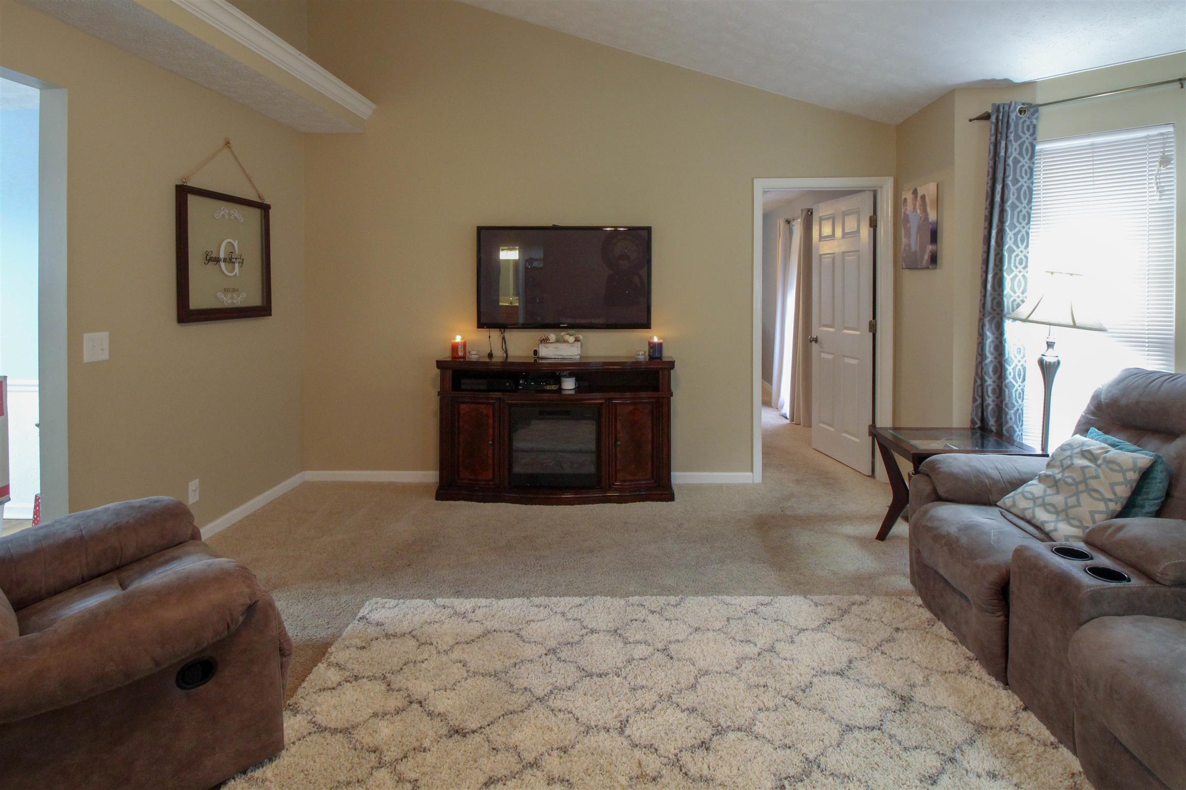 807 Hunters Crossing Lane Springfield, TN 37172 - Photo 9 of 16 a living room with furniture and a flat screen tv
