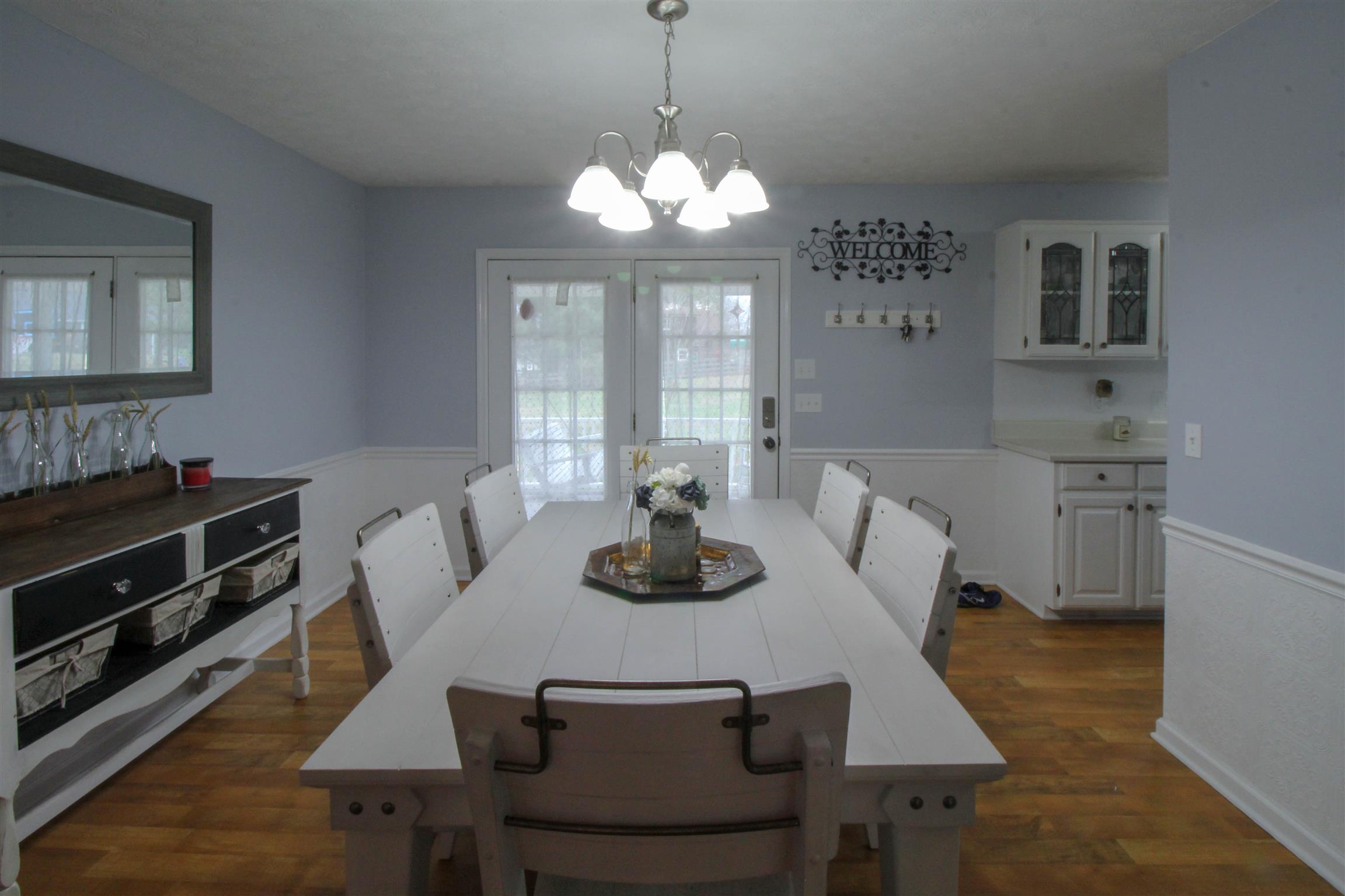 807 Hunters Crossing Lane Springfield, TN 37172 - Photo 10 of 16 a view of a dining room with furniture and wooden floor