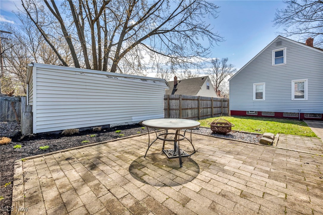 23761 Colbourne Road Euclid, OH 44123 - Photo 18 of 21 View of patio / terrace featuring a fireplace.