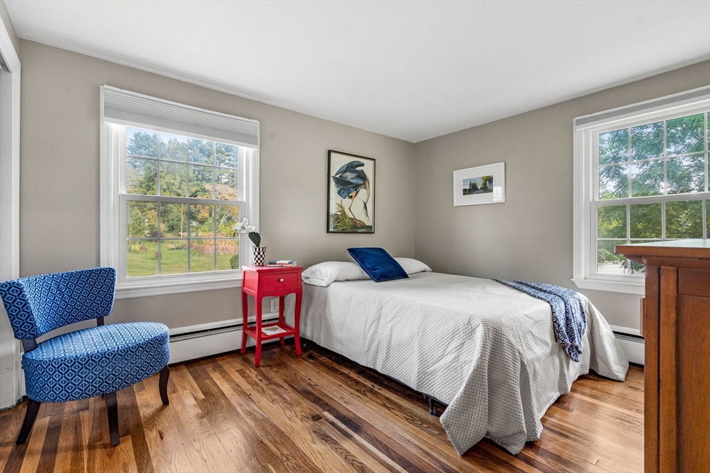 501 Farmers Row Groton, MA 01450 - Photo 12 of 19 a bedroom with a bed and a couch