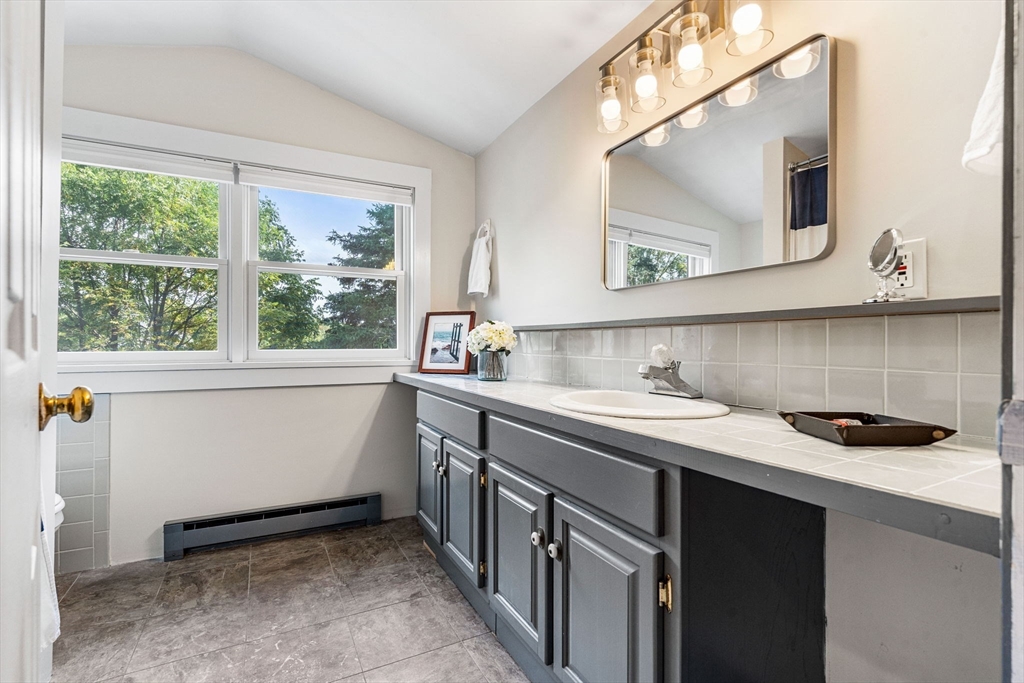 501 Farmers Row Groton, MA 01450 - Photo 15 of 19 a bathroom with a sink and a mirror