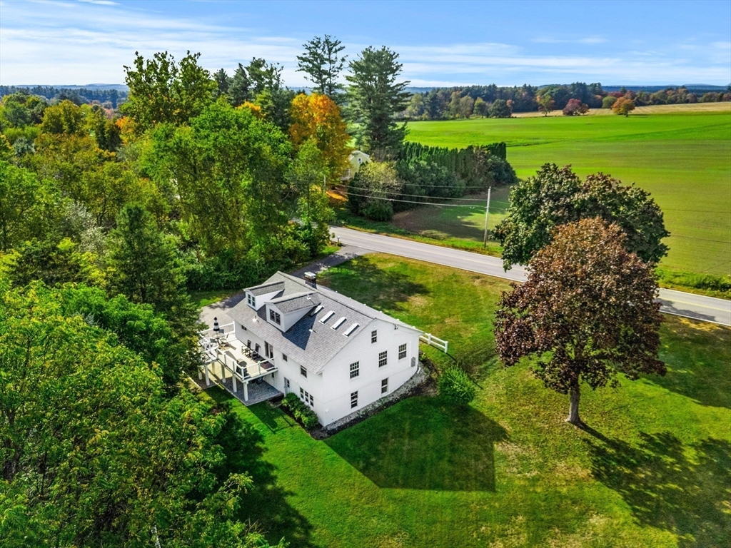 501 Farmers Row Groton, MA 01450 - Photo 19 of 19 a view of a big yard with potted plants and large trees