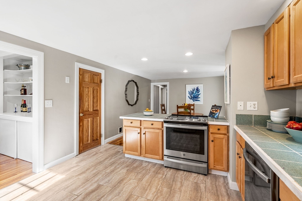 501 Farmers Row Groton, MA 01450 - Photo 4 of 19 a kitchen with stainless steel appliances granite countertop a stove and a refrigerator