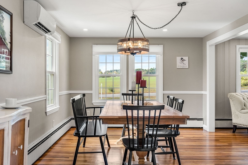 501 Farmers Row Groton, MA 01450 - Photo 9 of 19 a view of a dining room with furniture window and wooden floor