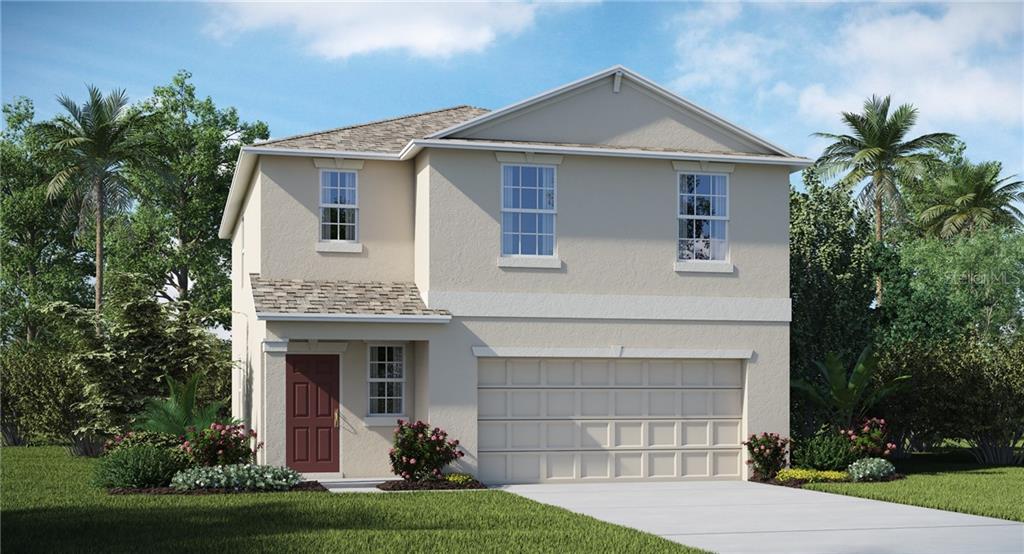 6956 Emerald Spring Loop New Port Richey, FL 34653 - Photo 1 of 1 a front view of a house with a garden and plants