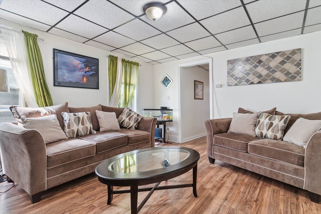 100 Bailey Street, Unit 3 Lawrence, MA 01843 - Photo 4 of 13 a living room with furniture and wooden floor