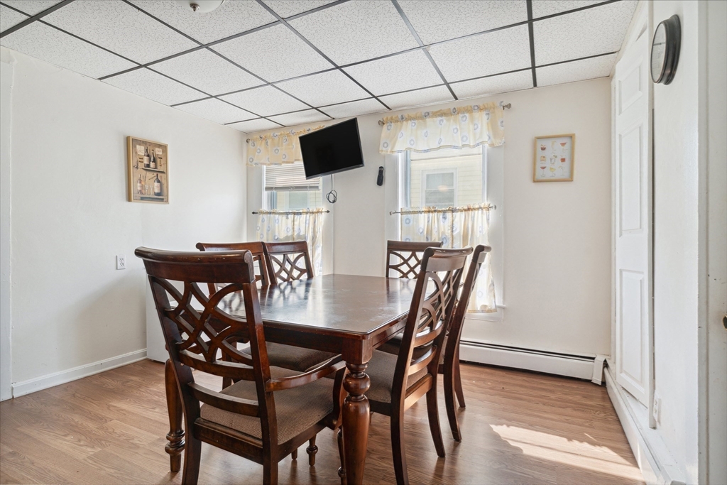 100 Bailey Street, Unit 3 Lawrence, MA 01843 - Photo 6 of 13 a view of a dining room with furniture and wooden floor