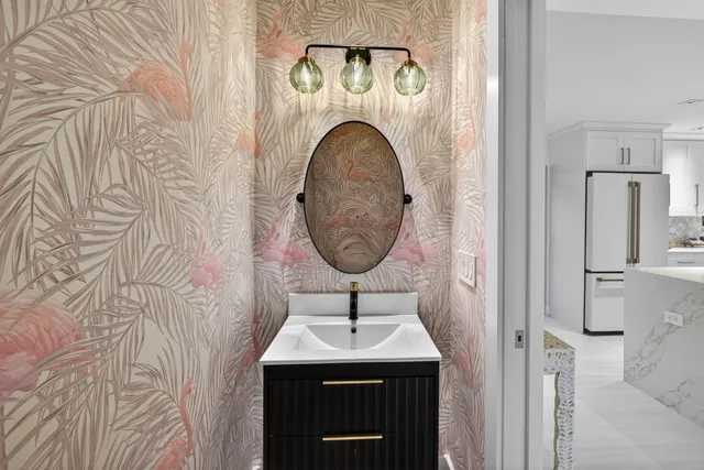 a bathroom with a double vanity sink and mirror