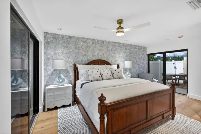 a bedroom with a large bed and a window